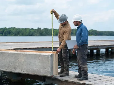 Contractor retrofitting a dock plate